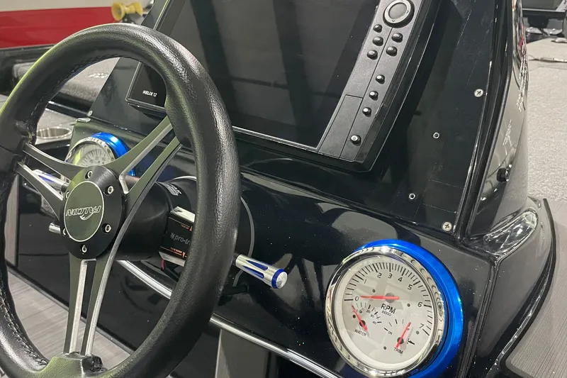 Slide: The Image of Steering wheel and dashboard of 2021 Falcon F21 boat with gauges and display. - 5