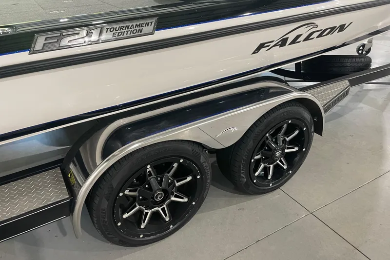 Slide: The Image of 2021 Falcon F21 Tournament Edition boat trailer with sleek black wheels. - 9