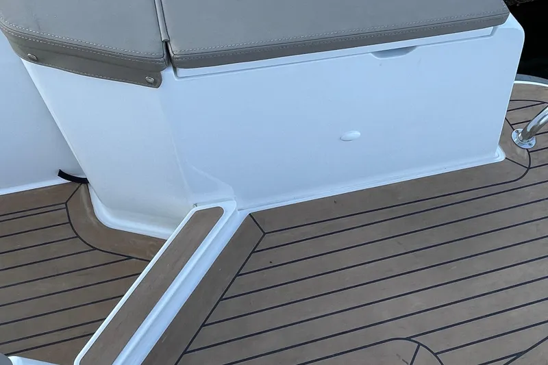 Slide: The Image of 2023 Nimbus c9-30 boat deck with cushioned seating and wood-patterned flooring. - 17