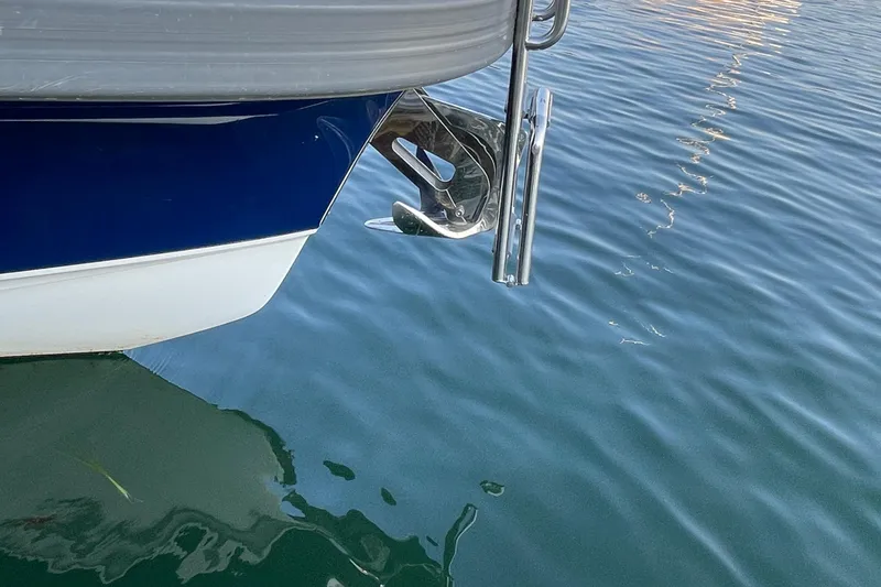 Slide: The Image of Close-up of a 2023 Nimbus c9-30 boat anchor above calm water. - 21