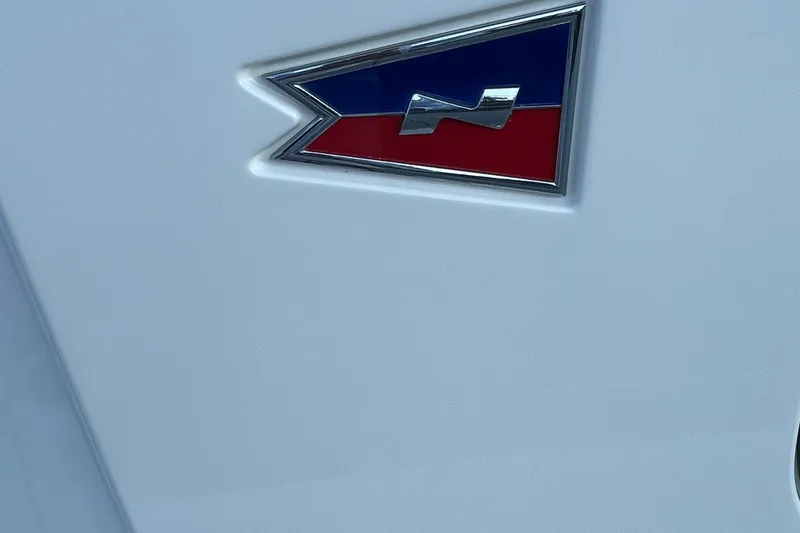 Slide: The Image of 2023 Nimbus c9-30 emblem on white surface, featuring blue and red design. - 23