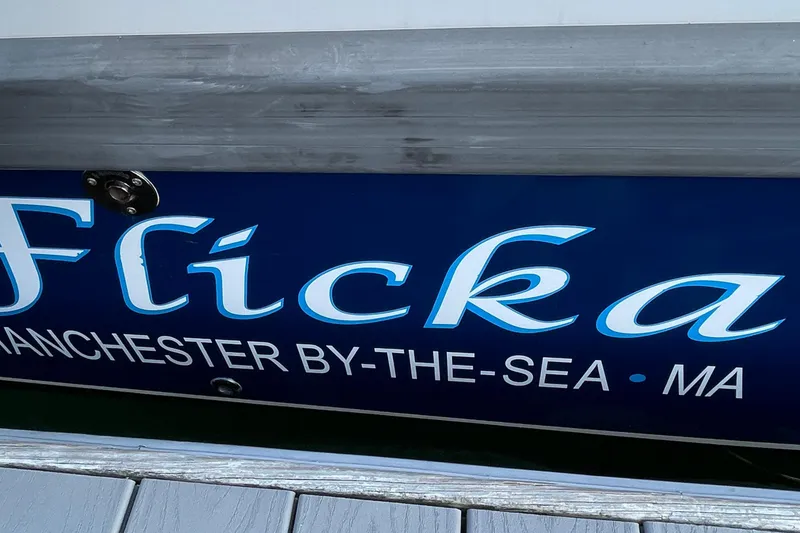 Slide: The Image of Blue boat with "Flicka" and "Manchester-by-the-Sea, MA" text, Nimbus c9-30, 2023 model. - 24