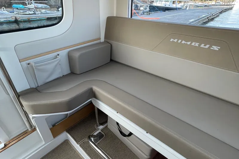Slide: The Image of Luxurious seating area on 2023 Nimbus C9-30 boat, featuring comfortable cushions and elegant design. - 29