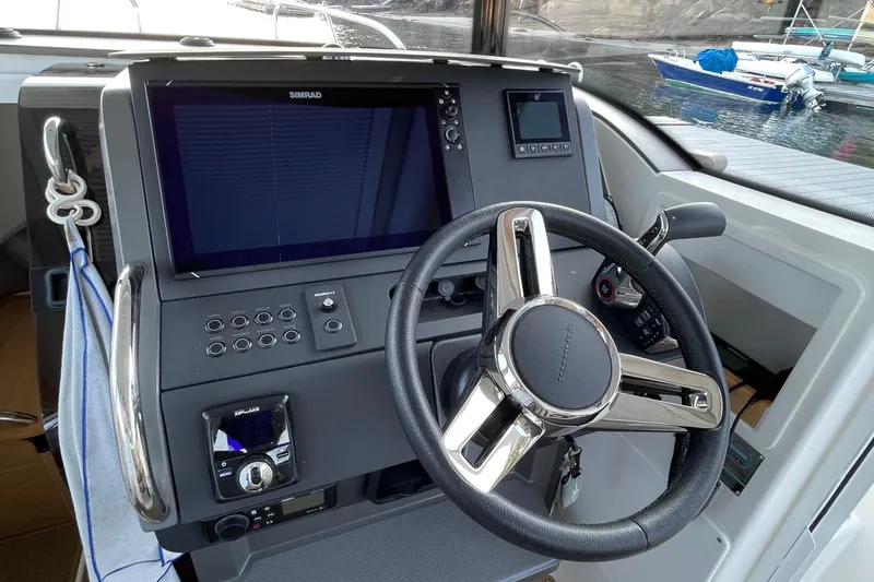 Slide: The Image of Steering console of 2023 Nimbus C9-30 boat with advanced navigation system. - 31
