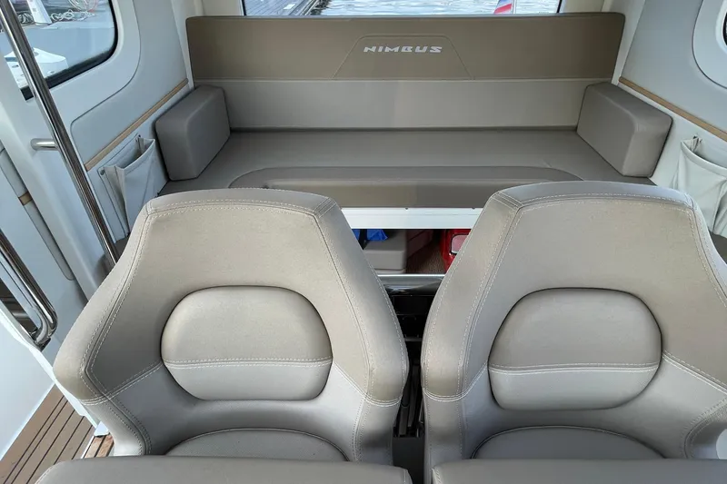 Slide: The Image of Interior of 2023 Nimbus C9-30 boat with seating and storage compartments. - 38