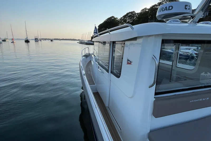 Slide: The Image of Nimbus C9-30 boat on calm water at sunset, 2023 model. - 39