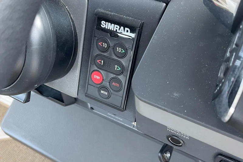 Slide: The Image of Control panel of a 2023 Nimbus c9-30 boat featuring Simrad navigation system. - 45