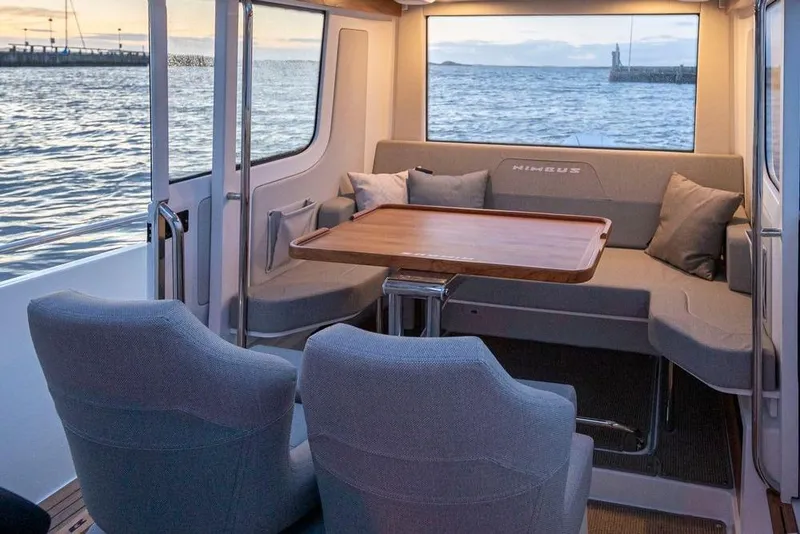 Slide: The Image of Luxurious interior of 2023 Nimbus C9-30 boat with ocean view and comfortable seating. - 5