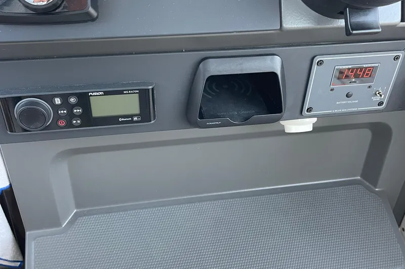 Slide: The Image of Control panel of a 2023 Nimbus c9-30 with audio system and voltage display. - 9