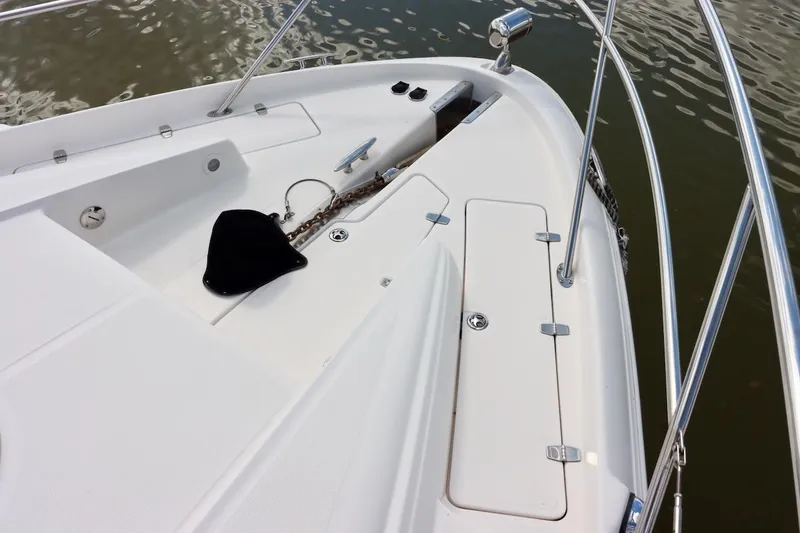 Slide: The Image of 2006 Regal Commodore 4460 boat deck with anchor chain and railing. - 21