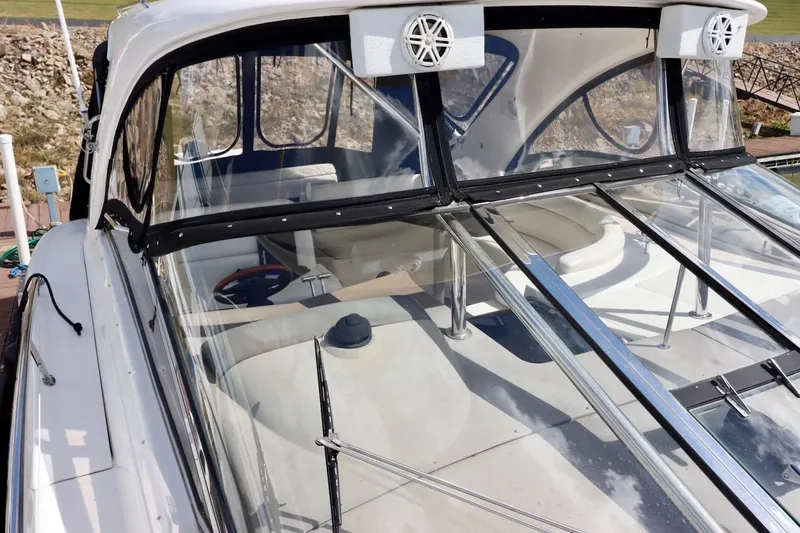 Slide: The Image of 2006 Regal Commodore 4460 boat with clear canopy and sleek design. - 22