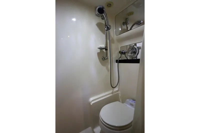 Slide: The Image of 2006 Regal Commodore 4460 bathroom with shower and toilet. - 31
