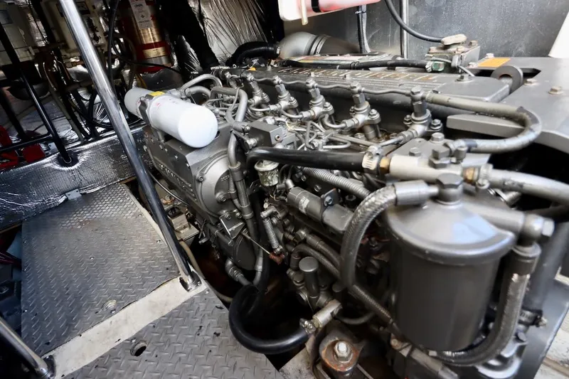 Slide: The Image of Engine room of 2006 Regal Commodore 4460 yacht, showcasing detailed mechanical components. - 33