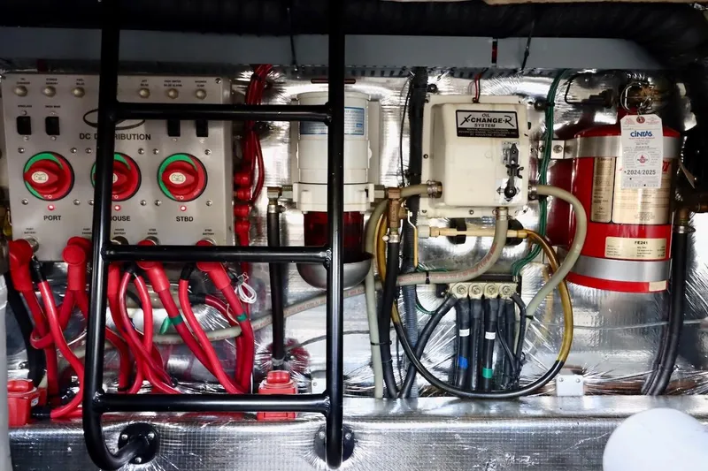 Slide: The Image of Engine room of 2006 Regal Commodore 4460 with control panels and wiring. - 34