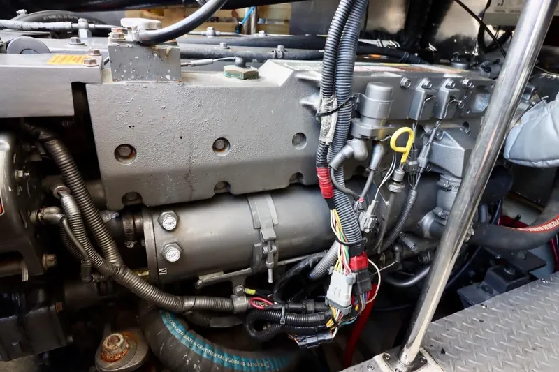 Slide: The Image of Engine compartment of a 2006 Regal Commodore 4460 with visible wiring and components. - 36