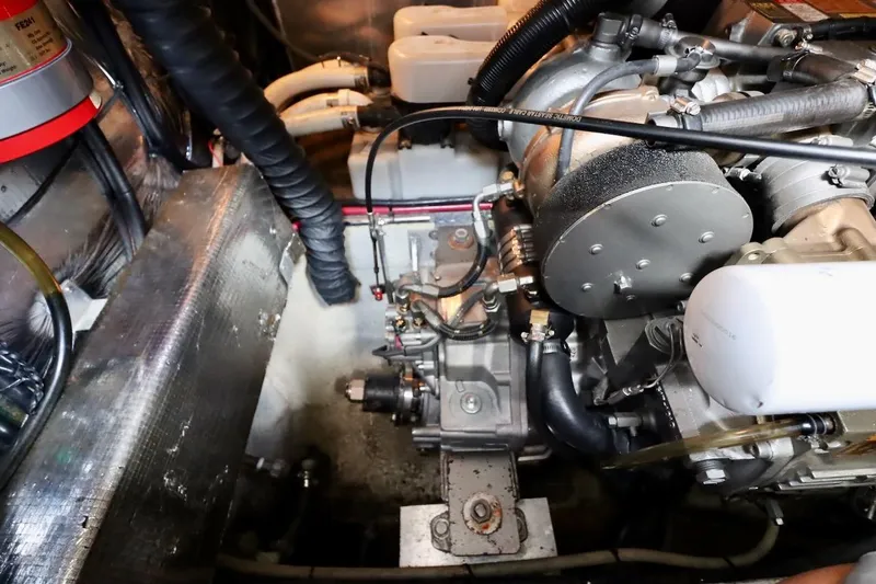 Slide: The Image of Engine compartment of 2006 Regal Commodore 4460 boat, showcasing mechanical components and wiring. - 37