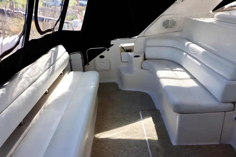 Slide: The Image of Interior of 2006 Regal Commodore 4460 yacht with white leather seating. - 4