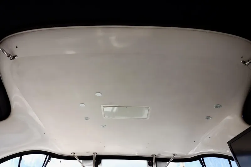 Slide: The Image of Ceiling view of 2006 Regal Commodore 4460 boat interior with lighting fixtures. - 7