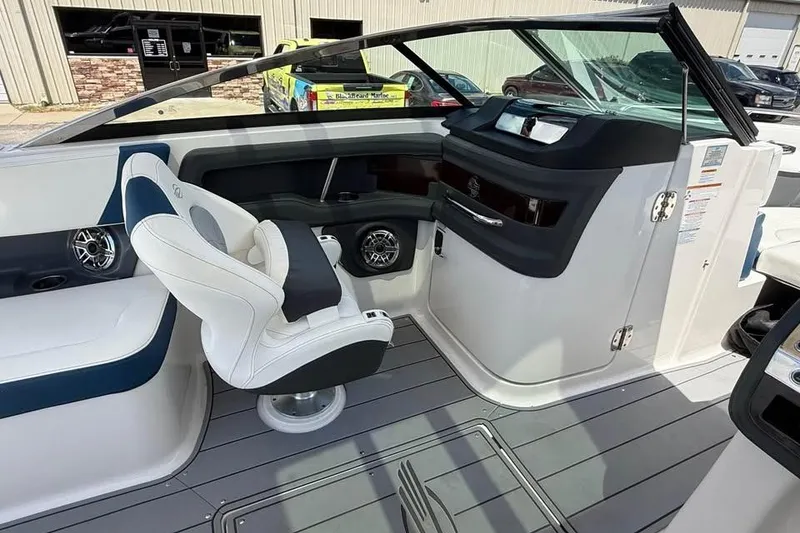 Slide: The Image of 2022 Chaparral 28 Surf boat interior with modern helm and seating. - 14