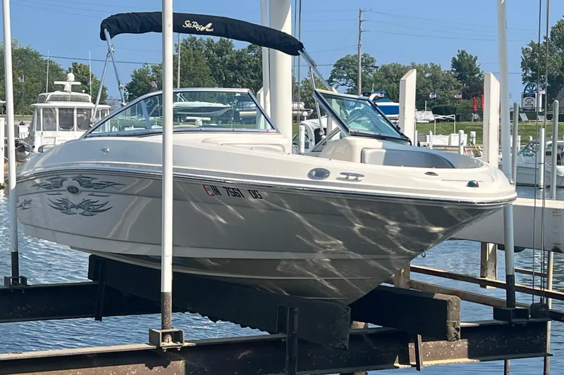 The Image of 2008 Sea Ray 205 Sport boat docked at marina, featuring sleek design and graphics. - 0