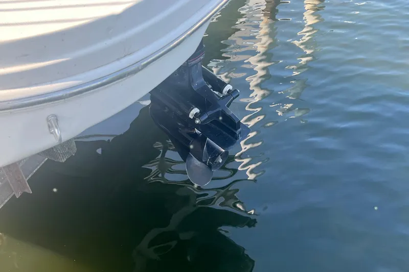 Slide: The Image of 2008 Sea Ray 205 Sport boat propeller submerged in water. - 10