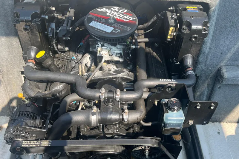 Slide: The Image of 2008 Sea Ray 205 Sport engine, featuring a 5.0L Mercury motor, detailed view. - 11