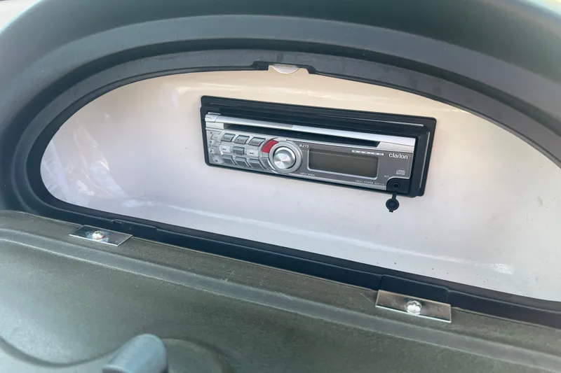 Slide: The Image of Clarion stereo system in 2008 Sea Ray 205 Sport boat dashboard. - 6