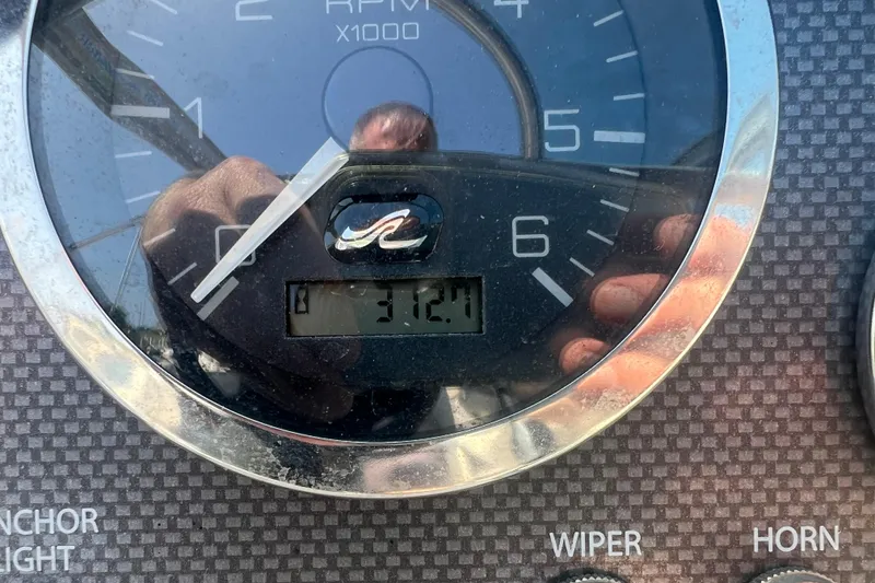 Slide: The Image of Close-up of 2008 Sea Ray 205 Sport tachometer showing 312.1 hours. - 7