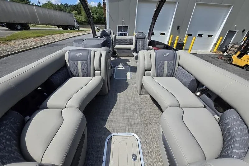 Slide: The Image of 2023 Barletta L25UCA pontoon boat interior with luxurious seating and modern design. - 14