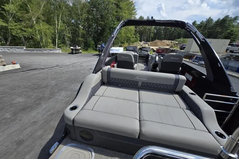 Slide: The Image of 2023 Barletta L25UCA pontoon boat with spacious seating and sleek design. - 6
