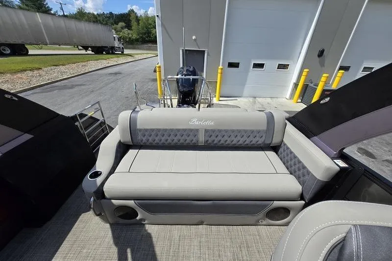 Slide: The Image of 2023 Barletta L25UCA boat interior with cushioned seating and modern design. - 7
