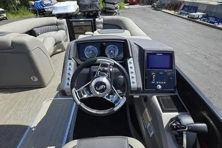 Slide: The Image of 2023 Barletta L25UCA boat interior with modern dashboard and steering wheel. - 8