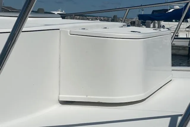 Slide: The Image of 2018 American Tug 365 boat deck with sleek white design and railing. - 20