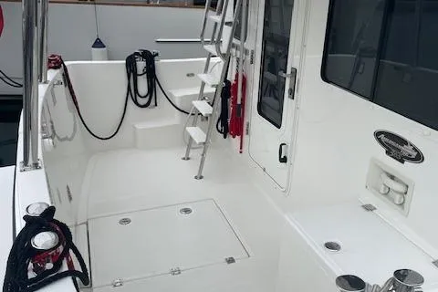 Slide: The Image of 2018 American Tug 365 boat deck with ladder and ropes. - 24