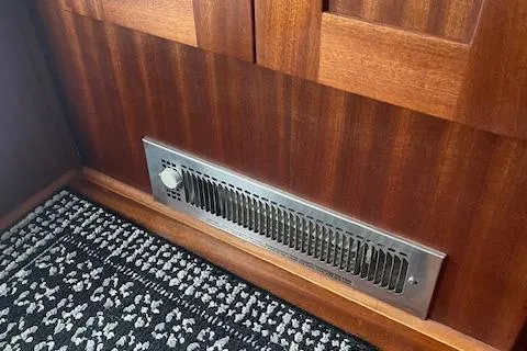 Slide: The Image of Vent on wooden paneling in 2018 American Tug 365 boat interior. - 33
