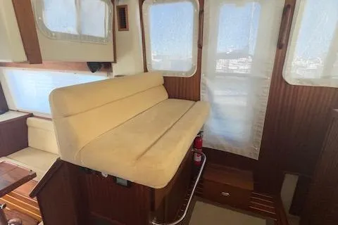 Slide: The Image of Interior of 2018 American Tug 365 with beige seating and wooden accents. - 44