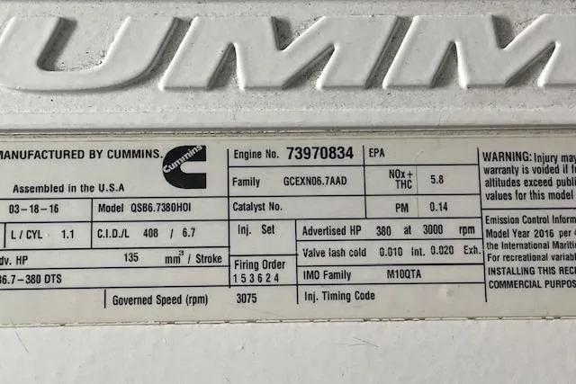 Slide: The Image of Engine specifications label for a 2018 American Tug 365, featuring Cummins model QSB6.7 engine details. - 48
