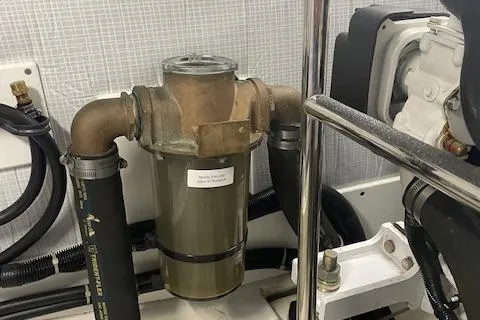 Slide: The Image of Engine room of 2018 American Tug 365 with visible filter and hoses. - 50