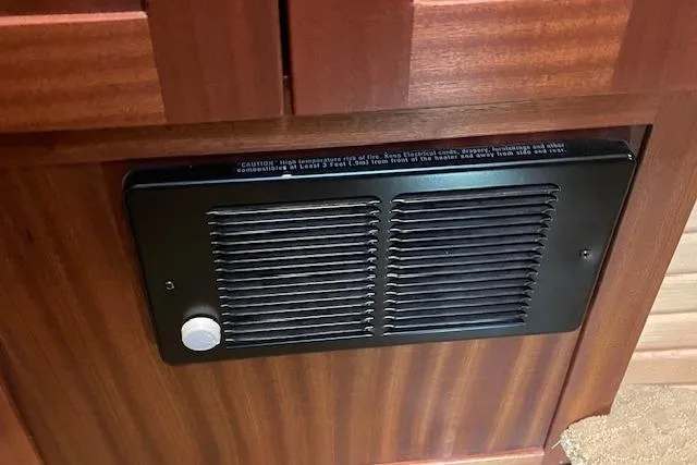 Slide: The Image of Ventilation panel on 2018 American Tug 365 boat, featuring wooden cabinetry. - 53