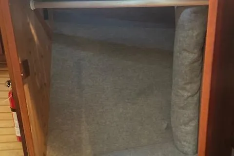 Slide: The Image of Interior cabin space of a 2018 American Tug 365 boat, featuring carpeted flooring. - 55