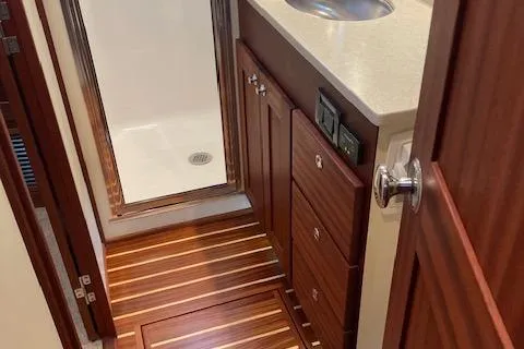 Slide: The Image of 2018 American Tug 365 bathroom with wood flooring and modern fixtures. - 56