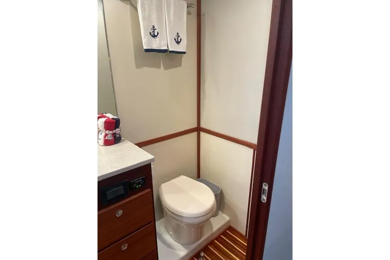 Slide: The Image of Bathroom interior of 2018 American Tug 365 with nautical-themed decor. - 58