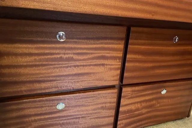 Slide: The Image of Wooden drawers with sleek metal handles on an American Tug 365, 2018 model. - 61
