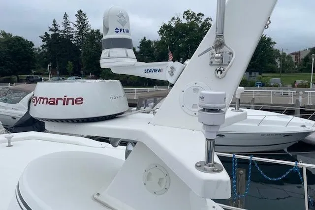 Slide: The Image of American Tug 365 (2018) with Raymarine and FLIR equipment at a marina. - 68