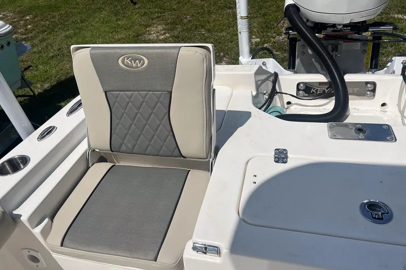 Slide: The Image of 2025 Key West 250 Bay Reef boat seat and deck, featuring elegant design and functionality. - 15
