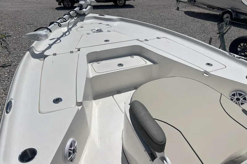 Slide: The Image of 2025 Key West 250 Bay Reef boat deck with seating and storage compartments. - 20