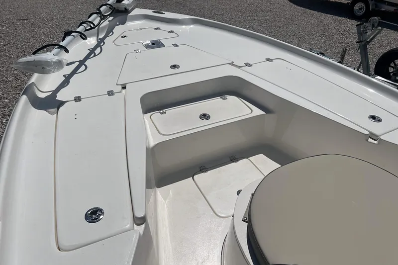 Slide: The Image of 2025 Key West 250 Bay Reef boat deck with storage compartments and seating. - 21