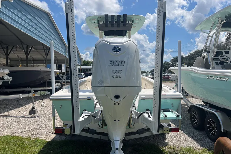 Slide: The Image of 2025 Key West 250 Bay Reef boat with powerful 300 V6 engine displayed outdoors. - 4