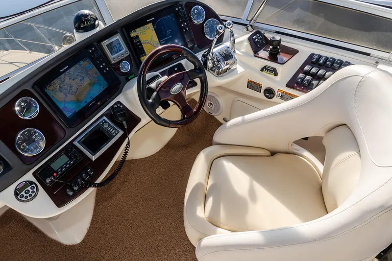 Slide: The Image of 2009 Meridian 391 Sedan helm with navigation screens, gauges, and a comfortable captain's chair. - 10