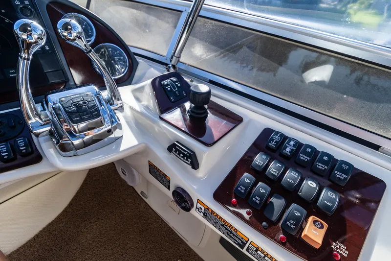 Slide: The Image of 2009 Meridian 391 Sedan helm with controls and navigation instruments. - 16